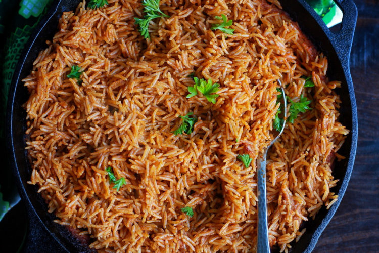 Cameroonian jollof rice with fresh herbs